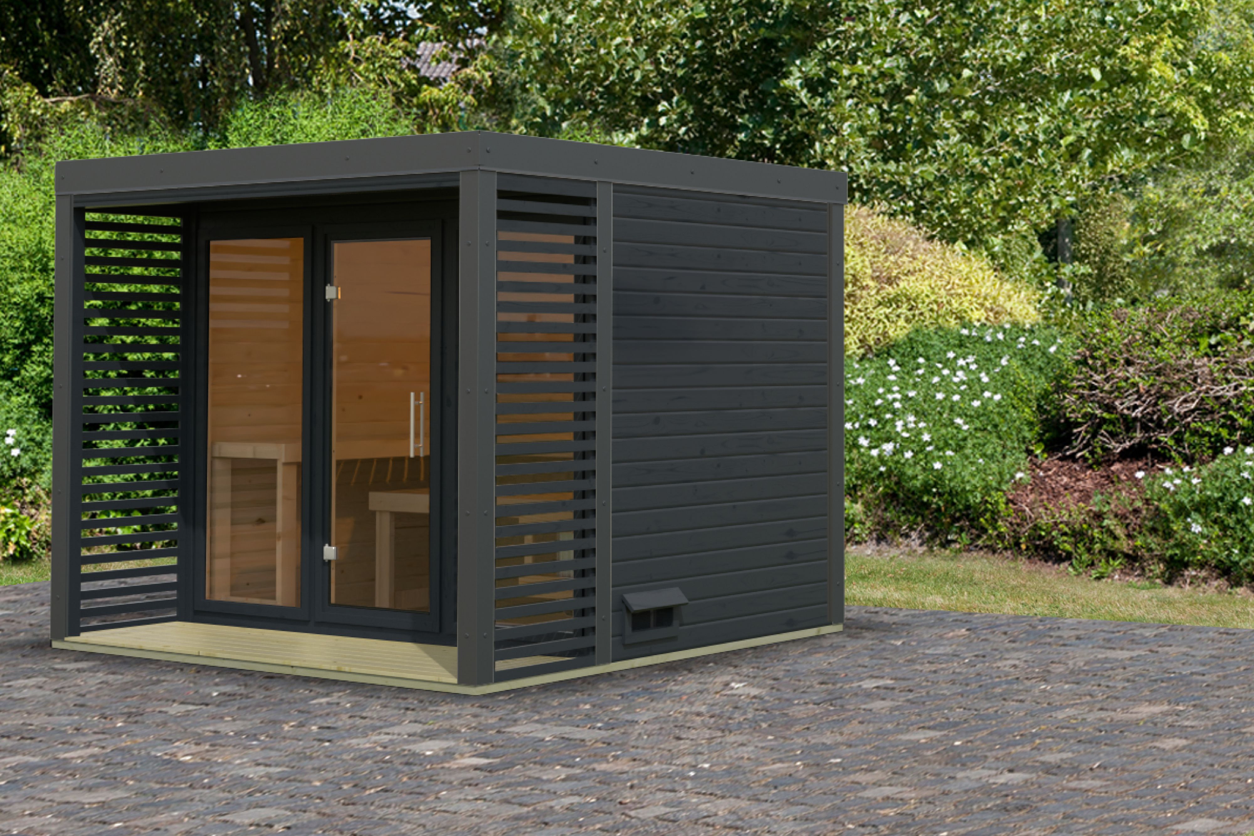 Karibu Saunahaus Ares 3 als Gartensauna aus Massivholz im Garten mit Glasfront